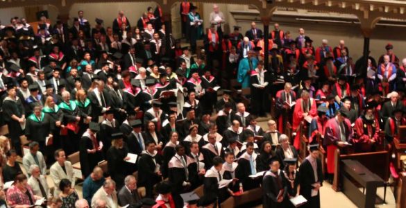 A photo of hundreds of graduates at the University of Divinity March 2018 ceremony, taken from above looking down, from the balcony of St Michael's Uniting church